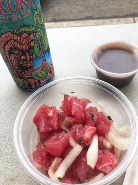 tuna poke in plastic tub with poi and coconut water