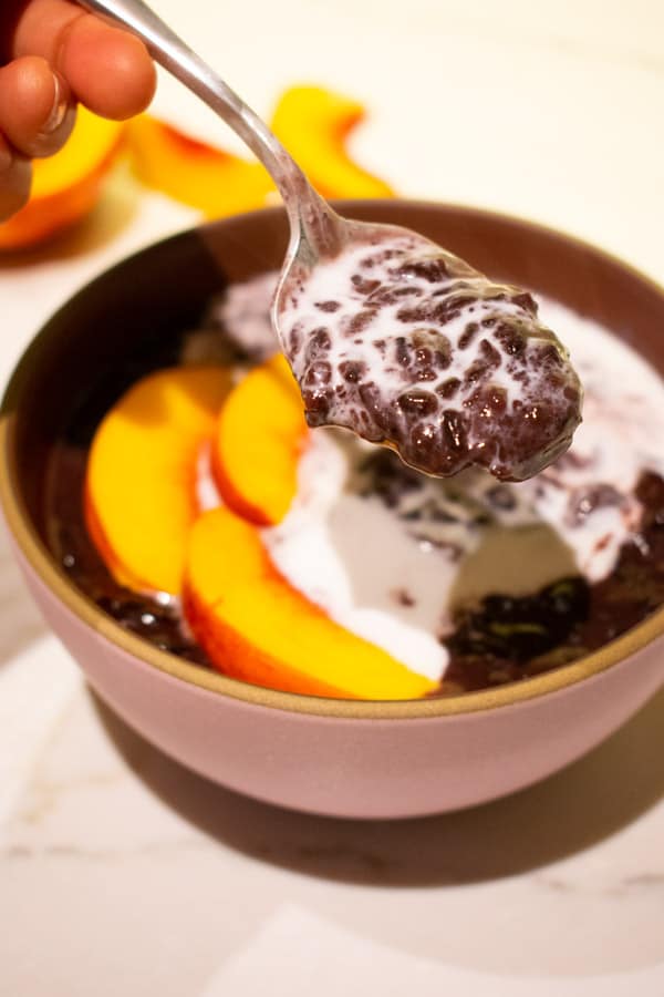 superfood thai black rice pudding with coconut milk and peaches