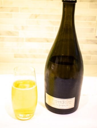sparkling riesling bottle and glass of wine