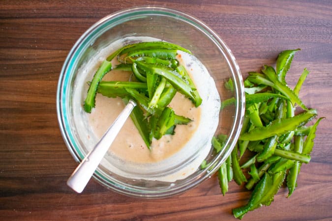 coconut dressing in glass bowl with wing beans