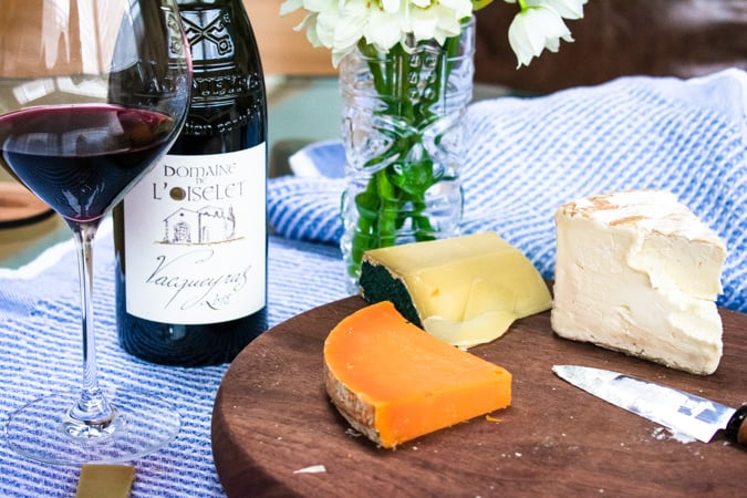 3 French Cheeses and a bottle and glass of Vacqueyras French red wine