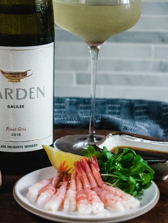 Yarden Wines pinot gris bottle and glass with plate of raw spot prawns