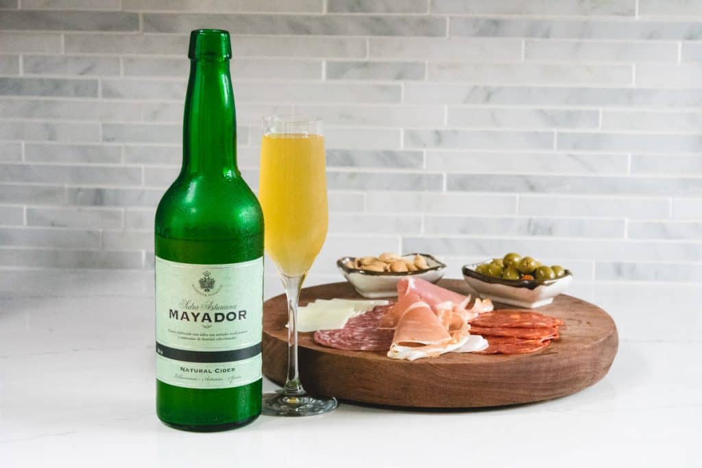 Mayador still cider with a charcuterie board